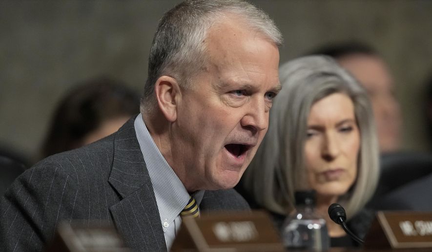 Sen. Dan Sullivan, R-Alaska, speaks during the Senate Armed Services Committee confirmation hearing for Pete Hegseth, President-elect Donald Trump's choice to be Defense secretary, at the Capitol in Washington, Tuesday, Jan. 14, 2025. (AP Photo/Ben Curtis)