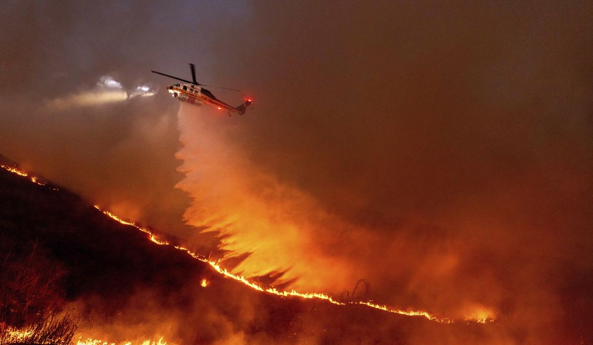 NextImg:Three people charged with arson near raging Los Angeles wildfires