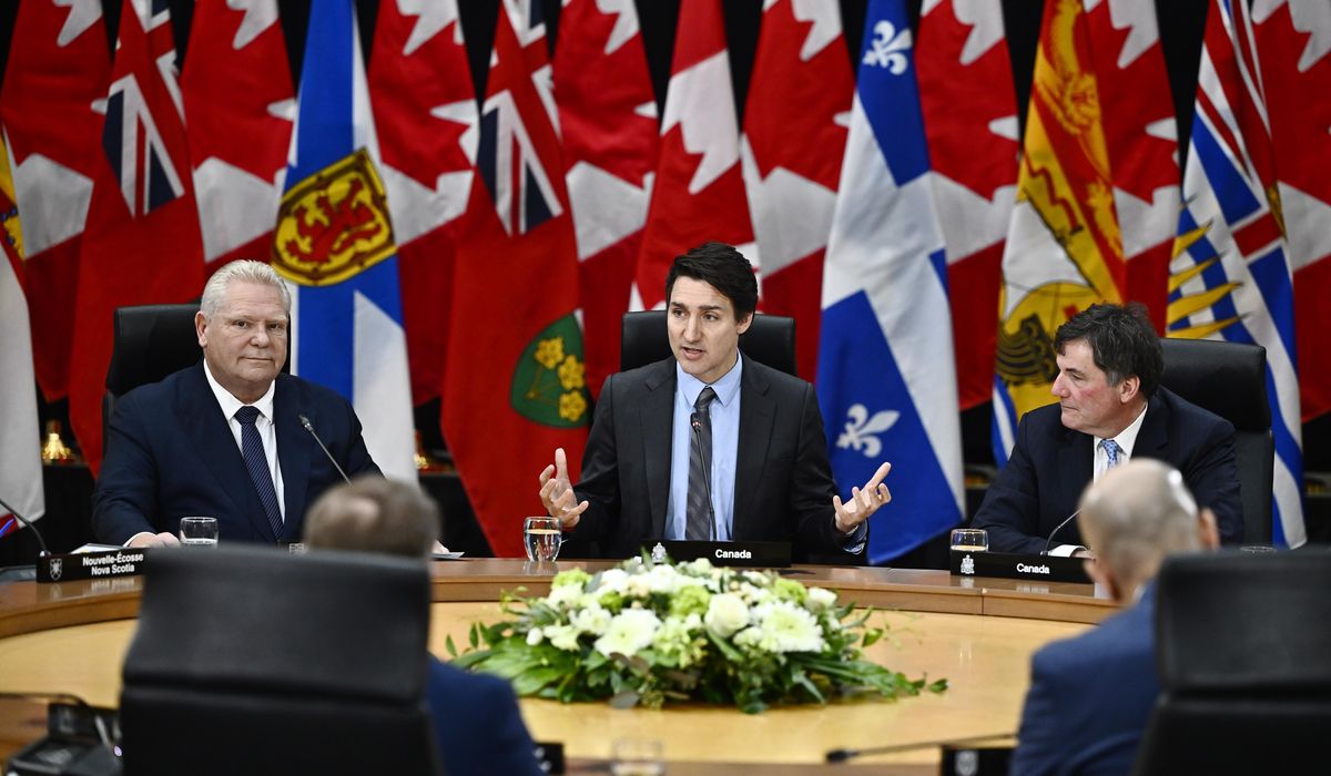 NextImg:Trudeau vows Canada will respond to Trump’s tariffs, but says burden will be shared across regions