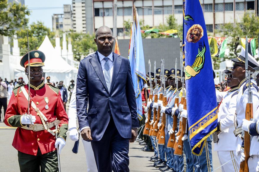 Mozambique's President-elect, Daniel Chapo, center, inspects honour guards during his inauguration ceremony in Maputo, Mozambique, Wednesday, Jan. 15, 2025. (AP Photo/Carlos Uqueio)
