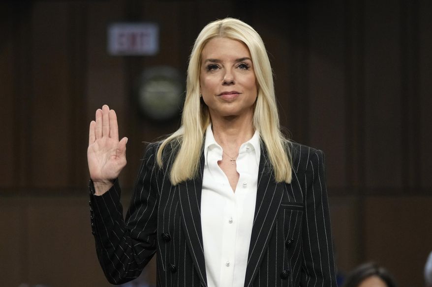 Pam Bondi, President-elect Donald Trump's choice to lead the Justice Department as attorney general, is sworn in before the Senate Judiciary Committee for her confirmation hearing, at the Capitol in Washington, Wednesday, Jan. 15, 2025. (AP Photo/Ben Curtis)
