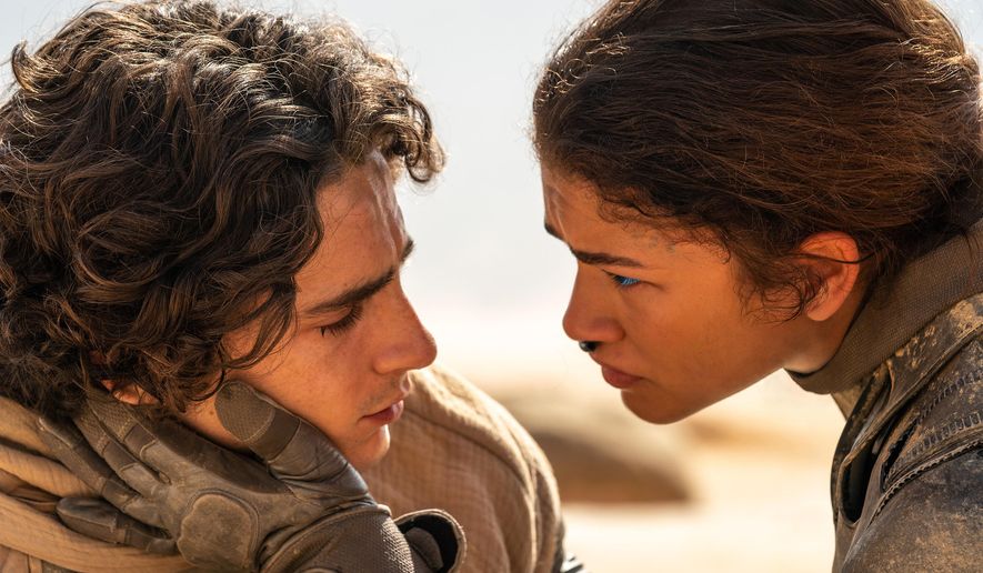 This image released by Warner Bros. Pictures shows Timothee Chalamet, left, and Zendaya in a scene from "Dune: Part Two." (Niko Tavernise/Warner Bros. Pictures via AP)