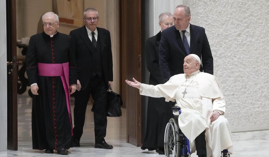 Pope Francis arrives in the Paul VI hall on the occasion of the weekly general audience at the Vatican, Wednesday, Jan. 15, 2025. (AP Photo/Gregorio Borgia)