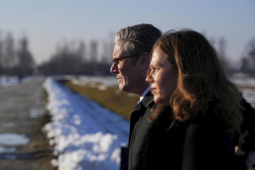 Britain's Prime Minister Keir Starmer and his wife Victoria Starmer visit the Memorial And Museum Auschwitz-Birkenau, a former Nazi German concentration and extermination camp, in Oswiecim, Poland, Friday Jan. 17, 2025. (Aleksandra Szmigiel/Pool via AP)