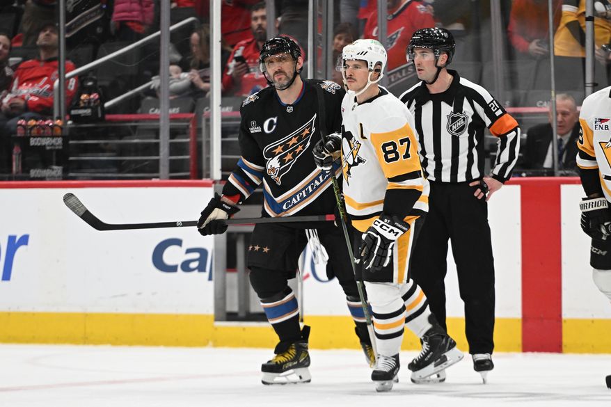 Washington Capitals left wing Alex Ovechkin (8) and Pittsburgh Penguins center Sidney Crosby (87) skating off the ice after hearing the explanation from the referee about the assessment of penalties during the second period of an NHL game at Capital One Arena in Washington D.C., January 18, 2025. (Photo for the Washington Times)