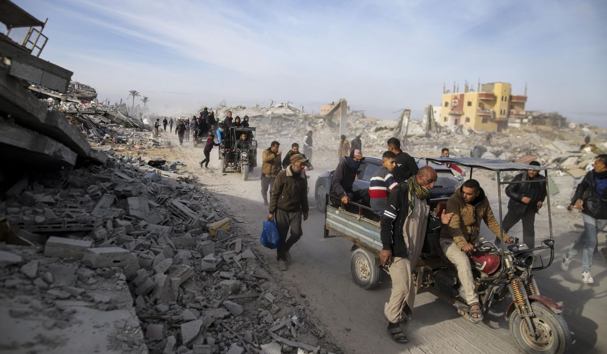 NextImg:Palestinians trek across rubble to return to their homes as Gaza ceasefire takes hold