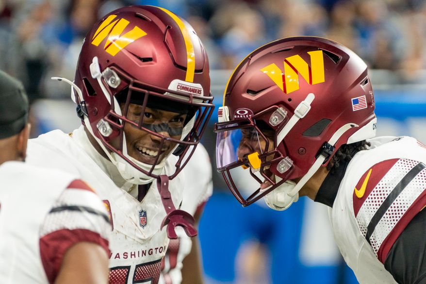 Washington Commanders Quarterback Jayden Daniels (5) and Commanders Wide Receiver Terry McLaurin (17) celebrate after 58 yard touchdown play at Ford Field, Detroit, Michigan, January 18th, 2025. Washington Commanders defeat the Detroit Lions 45-31 in Divisional Playoff game. (Photo by Jordan Sabillo, for the Washington Times)