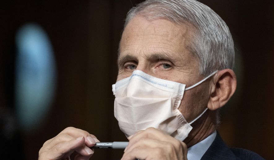 Dr. Anthony Fauci, director of the National Institute of Allergy and Infectious Diseases, listens during opening statements during a Senate Health, Education, Labor, and Pensions Committee hearing on Capitol Hill, Nov. 4, 2021, in Washington. (AP Photo/Alex Brandon) **FILE**