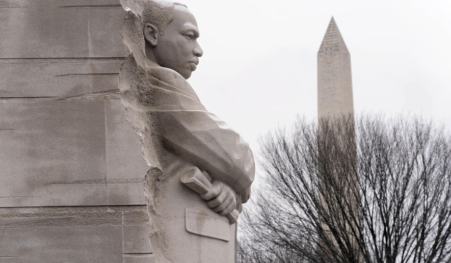 FILE - A view of the Martin Luther King Jr. Memorial, backdropped by the Washington Monument during the annual MLK wreath-laying ceremony in Washington, Jan. 15, 2024. ( AP Photo/Jose Luis Magana, File)