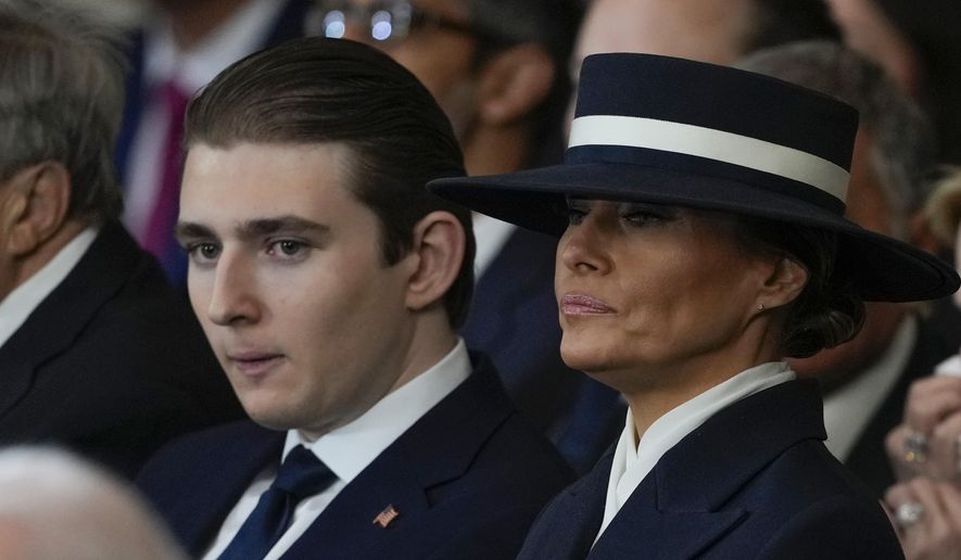 Barron Trump and first lady Melania Trump listen as President Donald Trump gives his inaugural address during the 60th Presidential Inauguration in the Rotunda of the U.S. Capitol in Washington, Monday, Jan. 20, 2025. (AP Photo/Julia Demaree Nikhinson, Pool)