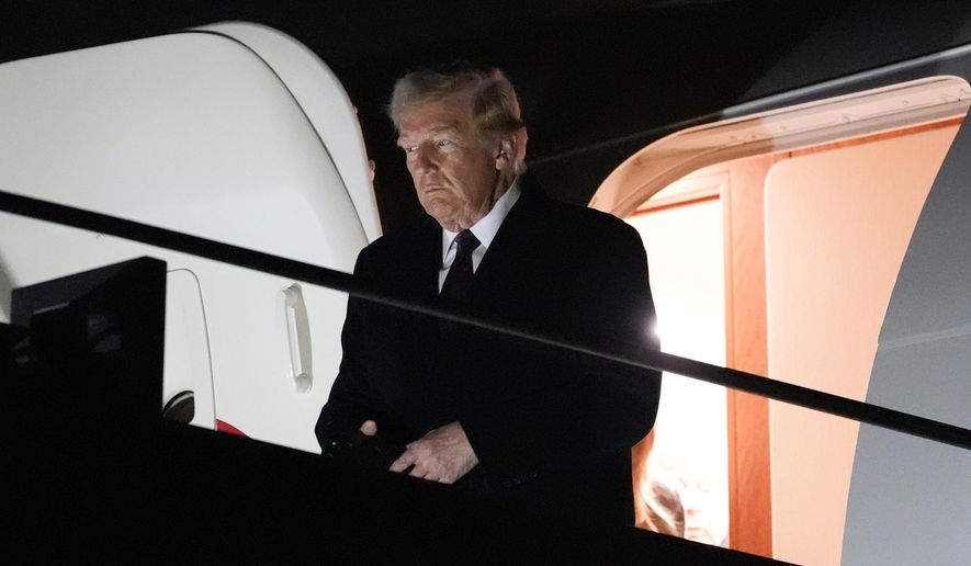 President-elect Donald Trump walks off an Air Force Special Mission airplane as he arrives at Dulles International Airport, Saturday, Jan. 18, 2025, in Dulles, Va. (AP Photo/Alex Brandon)