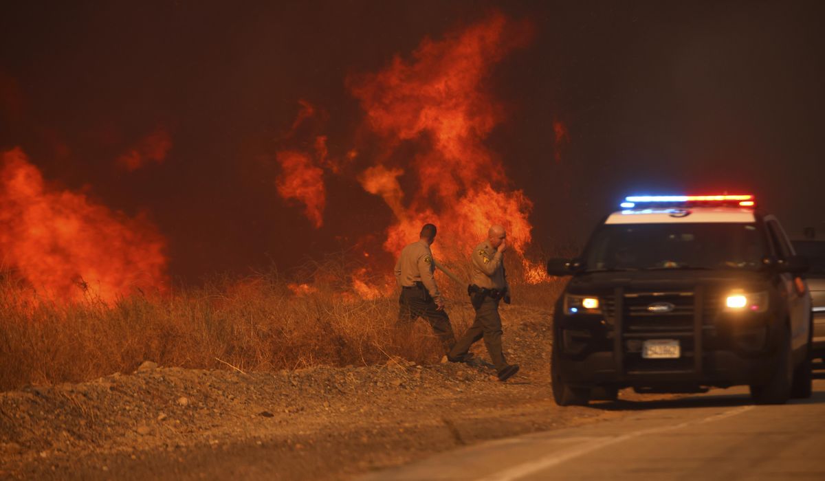 NextImg:Firefighters battle to maintain the upper hand on a huge fire north of Los Angeles