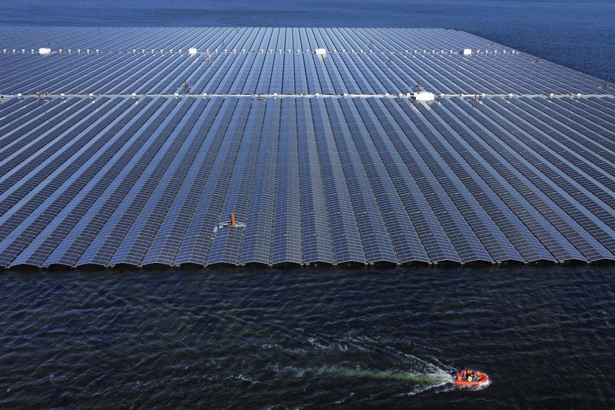 FILE - A floating solar farm operates on the Cottbuser Ostsee lake near Cottbus, Germany, Oct. 16, 2024. (AP Photo/Matthias Schrader, File)