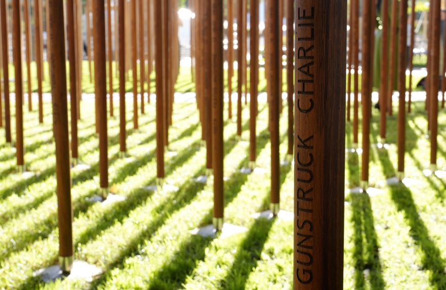 African "iroko" hardwood posts bear the names and the date of death of 1,700 Black South African servicemen who died in non-combatant roles in World War I and have no known grave, in Cape Town, South Africa, Wednesday, Jan. 22, 2025. (AP Photo/Nardus Engelbrecht)