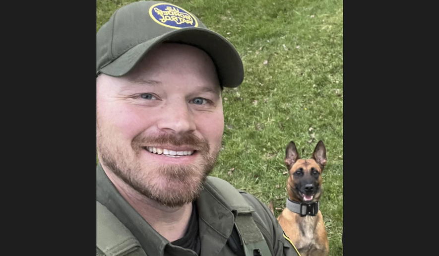 This undated image courtesy of Joan Maland shows U.S. Border Patrol agent David Maland and his K9 partner, Cora. David Maland was killed Monday, Jan. 20, 2025, following a traffic stop in Vermont. (David Maland/Joan Maland via AP)