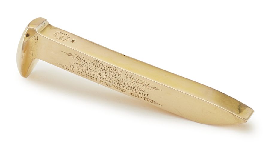 This image provided by Christie's Images shows a golden spike driven by President Warren G. Harding in Nenana, Alaska, just days before he died in office, which marked the completion of the Alaska Railroad over a century ago. (Christie's Images via AP)