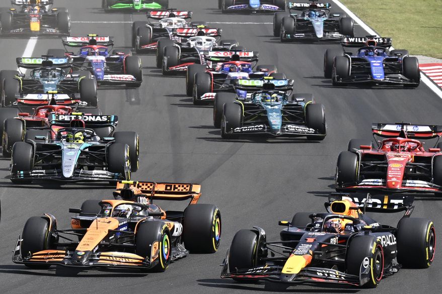 Drivers with their F1 cars start for the Hungarian Formula One Grand Prix race at the Hungaroring racetrack in Mogyorod, Hungary, Sunday, July 21, 2024. (AP Photo/Denes Erdos, File)