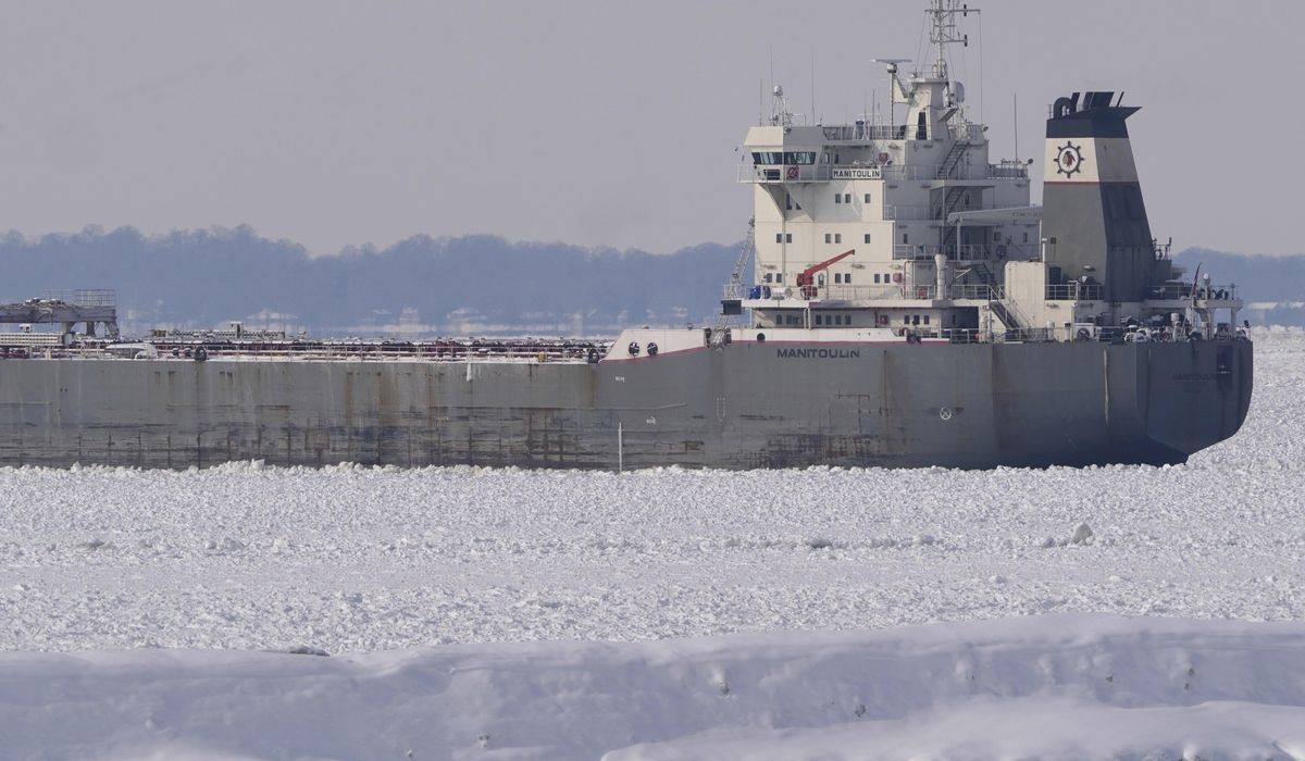 NextImg:Freighter remains stuck in the ice on a frozen Lake Erie