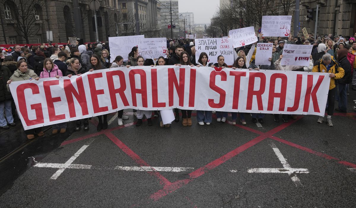 NextImg:A driver rams an anti-government rally in Serbia’s capital and injures one protester