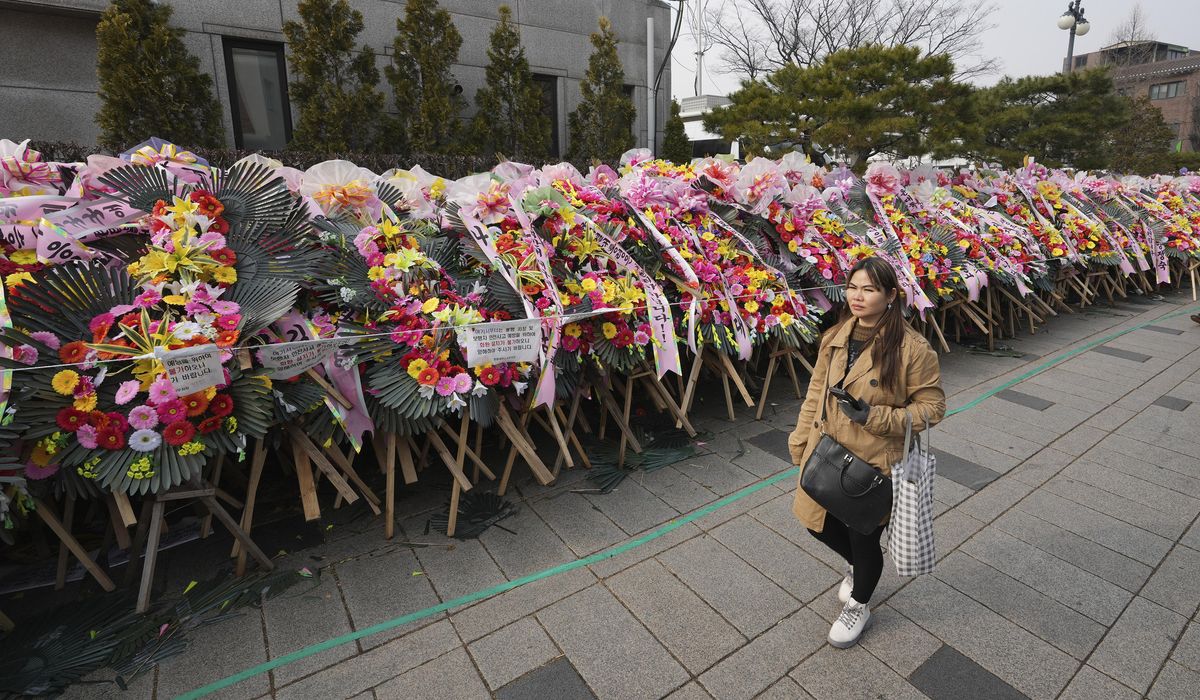 NextImg:South Koreans turn funeral wreaths and K-pop light sticks into political protest tools
