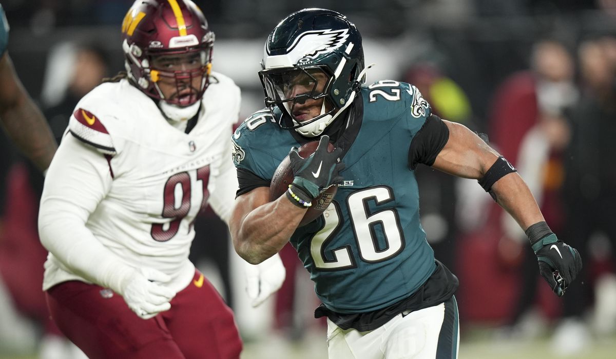 NextImg:Hurts, Barkley rush for 3 TDs each, lead Eagles over Washington, earn trip to Super Bowl