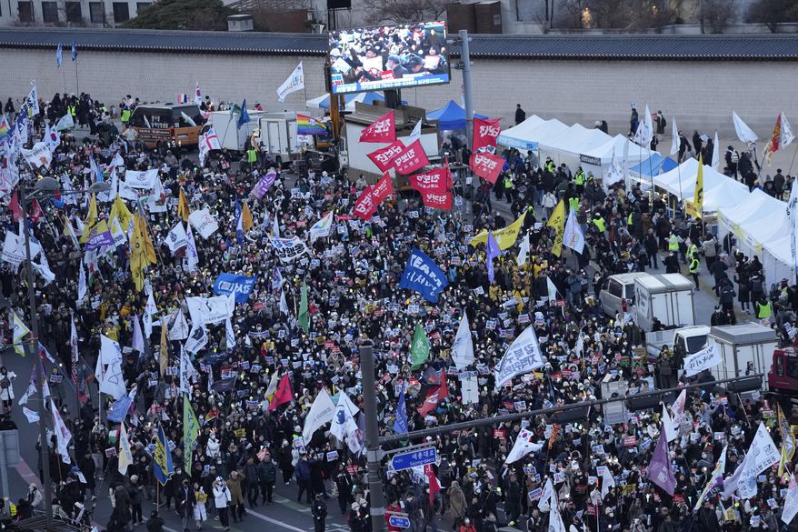 Protesters march during a rally demanding immediate indictment of impeached South Korean President Yoon Suk Yeol in Seoul, South Korea, Saturday, Jan. 25, 2025. (AP Photo/Ahn Young-joon)