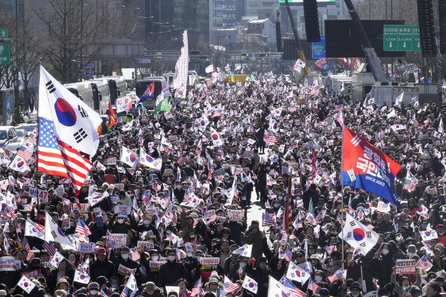Supporters of impeached South Korean President Yoon Suk Yeol stage a rally to oppose his impeachment in Seoul, South Korea, Saturday, Jan. 25, 2025. (AP Photo/Ahn Young-joon)