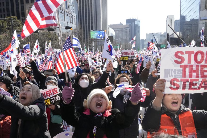 Supporters of impeached South Korean President Yoon Suk Yeol attend a rally to oppose his impeachment in Seoul, South Korea, Saturday, Jan. 25, 2025. (AP Photo/Ahn Young-joon)