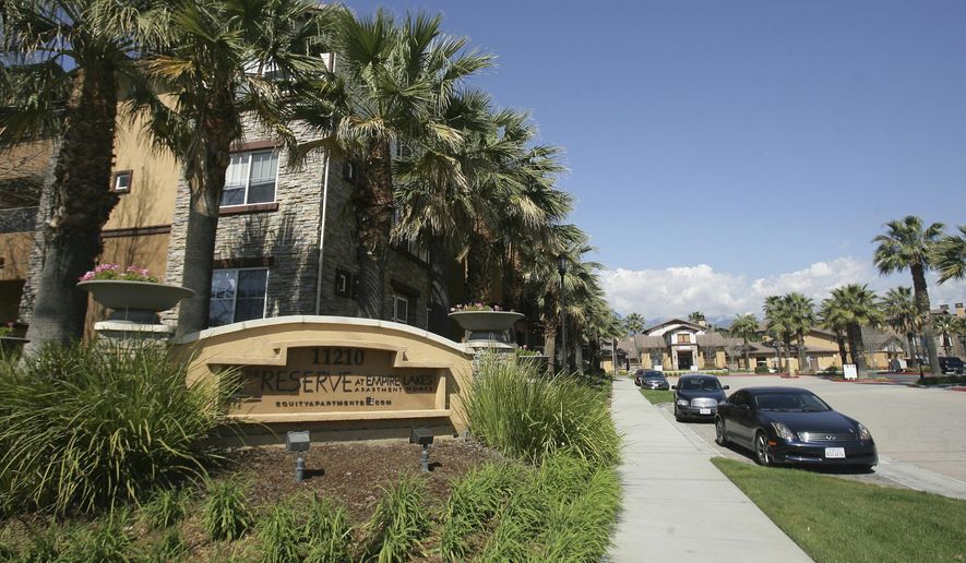 Federal agents raided about 20 locations, related to a birth tourism scheme, in three Southern California counties, including this apartment complex in Rancho Cucamonga, Calif., Tuesday, March 3, 2015. (Stan Lim/The Press-Enterprise via AP, File)