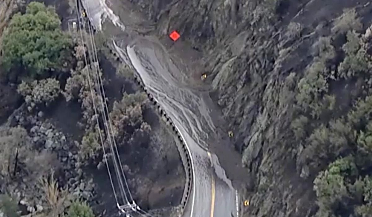 NextImg:Rain helps Southern California firefighters but sends ash and mud flowing down hillsides