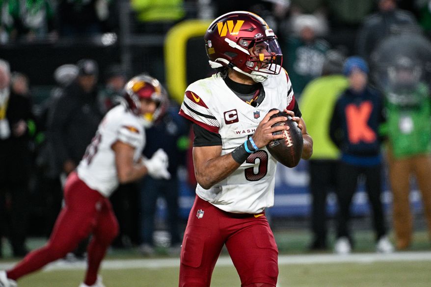 Washington Commanders quarterback Jayden Daniels (5) rolls out of the pocket while looking for an open receiver against the Philadelphia Eagles at Lincoln Financial Field in Philadelphia, Pennsylvania, Jan. 26, 2025. (Photo by Brian Murphy for the Washington Times) ** FILE **