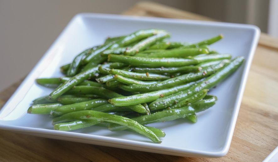 A plate of sauteed green beans is displayed in Lincoln, Neb., on Oct. 16, 2024. (Amber Pankonin via AP)