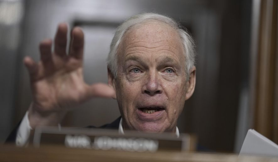 Sen. Ron Johnson, R-Wisc., questions Robert F. Kennedy Jr., President Donald Trump's choice to be Secretary of Health and Human Services, as he appears before the Senate Finance Committee for his confirmation hearing, at the Capitol in Washington, Wednesday, Jan. 29, 2025. (AP Photo/Ben Curtis)