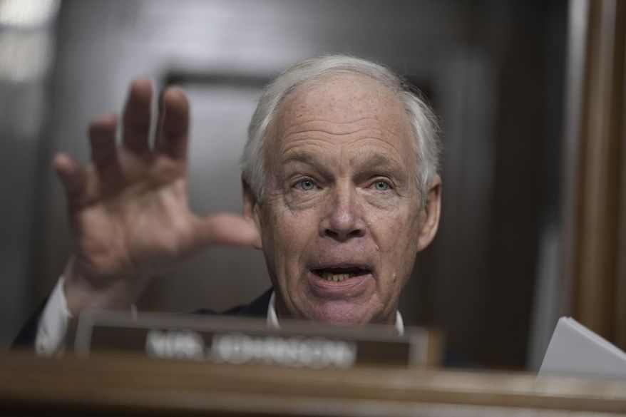 Sen. Ron Johnson, R-Wisc., questions Robert F. Kennedy Jr., President Donald Trump's choice to be Secretary of Health and Human Services, as he appears before the Senate Finance Committee for his confirmation hearing, at the Capitol in Washington, Wednesday, Jan. 29, 2025. (AP Photo/Ben Curtis)