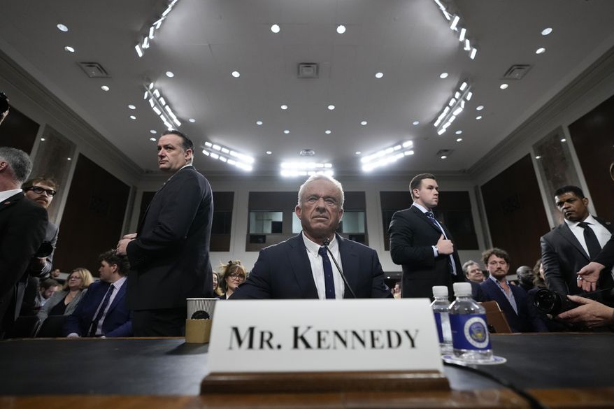 Robert F. Kennedy Jr., President Donald Trump's choice to be Secretary of Health and Human Services, appears before the Senate Finance Committee for his confirmation hearing, at the Capitol in Washington, Wednesday, Jan. 29, 2025. (AP Photo/Ben Curtis)