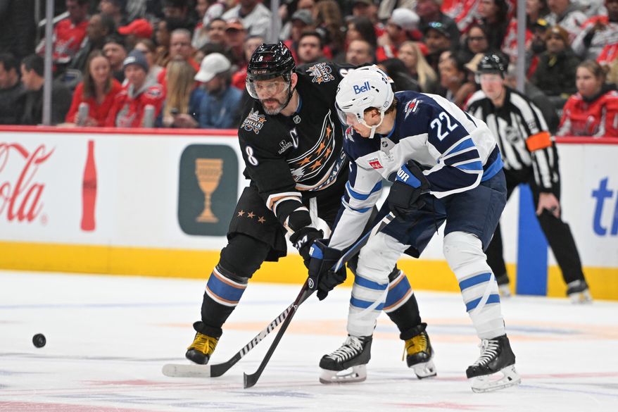 Washington Capitals left wing Alex Ovechkin (8) lined up outside the faceoff circle battling for the puck with Winnipeg Jets center Mason Appleton (22) during the first period of an NHL game at Capital One Arena in Washington D.C., February 1, 2025. (Photo for the Washington Times)