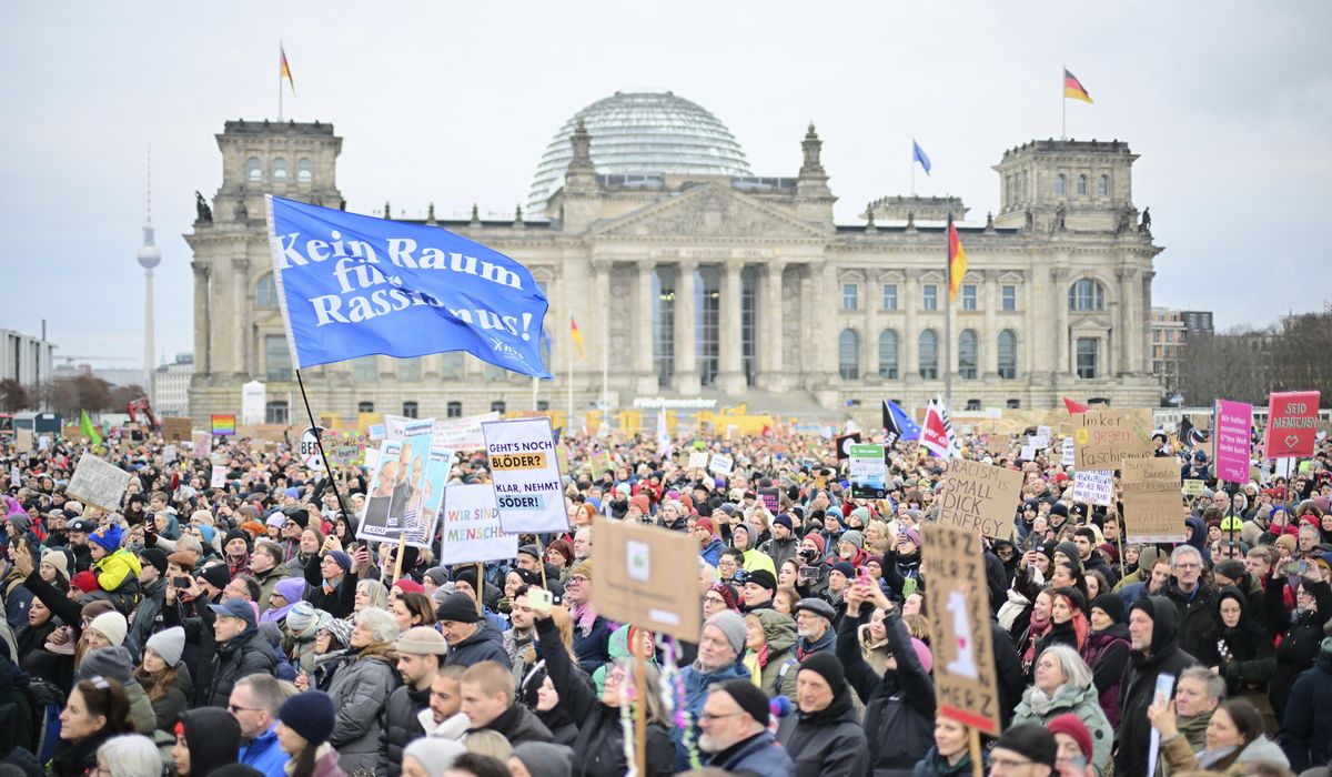 NextImg:Protesters rally against German party leader who pushed migration proposal backed by far-right
