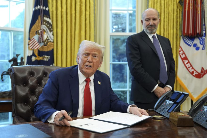 President Donald Trump speaks as Commerce Secretary Howard Lutnick listens in the Oval Office of the White House, Monday, Feb. 3, 2025, in Washington, as Trump prepares to sign an executive order. (AP Photo/Evan Vucci)
