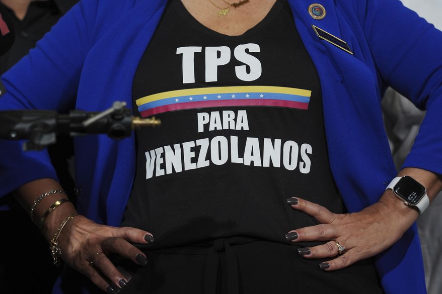 Activist Helene Villalonga wears a tee-shirt calling for Temporary Protected Status for Venezuelans during a press conference to denounce changes to the protections that shielded hundreds of thousands of Venezuelans from deportation, Monday, Feb. 3, 2025, in Doral, Fla. (AP Photo/Rebecca Blackwell)