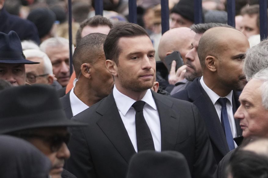 Jordan Bardella, president of far-right National Rally party, leaves Notre Dame du Val-de-Grace church after a public memorial for her father and late far-right leader Jean-Marie Le Pen, Thursday, Jan. 16, 2025 in Paris. Jean-Marie Le Pen, the founder of France's main far-right party, died on Jan.7, 2025 aged 96. (AP Photo/Thibault Camus)