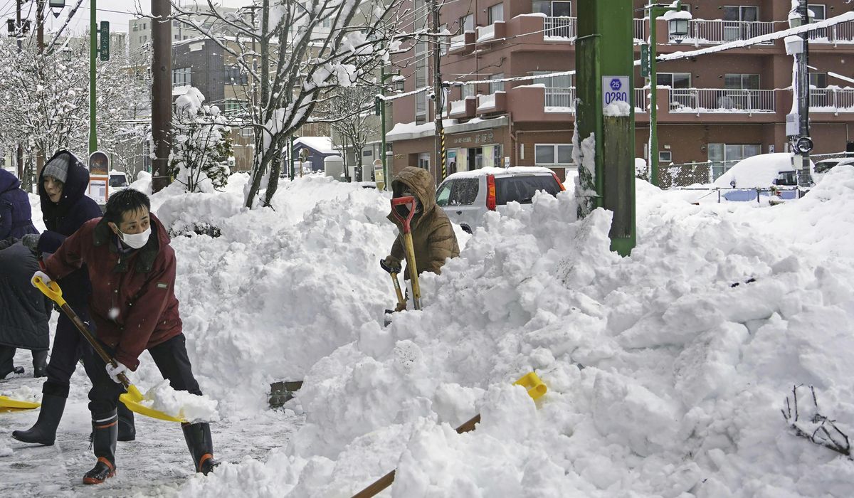 NextImg:Heavy snow hits northern Japan, disrupting daily life
