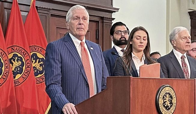 Nassau County Executive Bruce Blakeman, at podium, speaks during a news conference in Mineola, N.Y., March 6, 2024. (AP Photo/Philip Marcelo, File)
