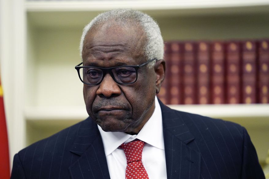 Supreme Court Associate Justice Clarence Thomas listens to President Donald Trump speak before swearing in Pam Bondi as Attorney General in the Oval Office of the White House, Wednesday, Feb. 5, 2025, in Washington. (AP Photo/Evan Vucci)