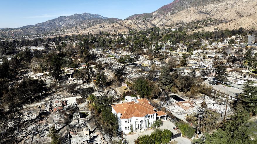 FILE - A lone home stands among residences levelled by the Eaton Fire in Altadena, Calif., on Tuesday, Jan. 21, 2025. (AP Photo/Noah Berger, File)