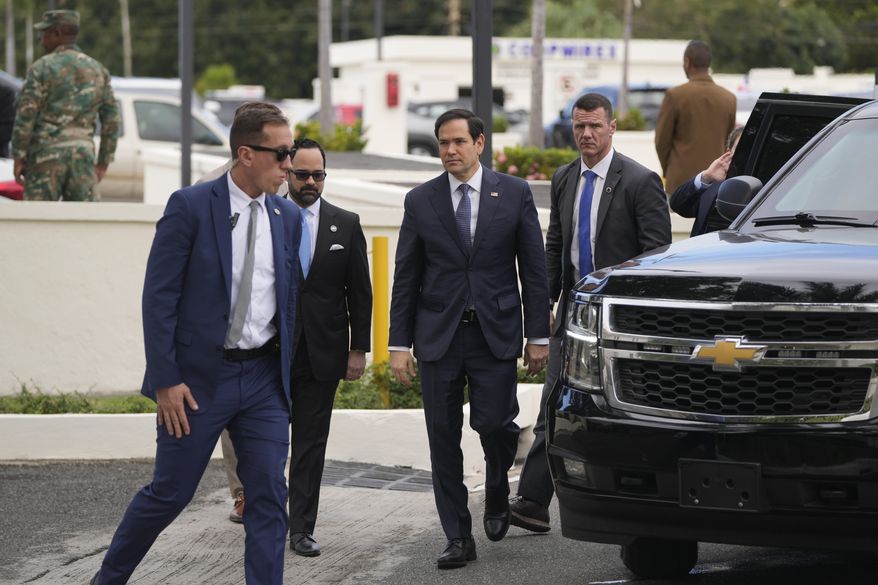 U.S. Secretary of State Marco Rubio, center, arrives to the National Palace for meetings in Santo Domingo, Dominican Republic, Thursday, Feb. 6, 2025. (AP Photo/Mark Schiefelbein, Pool)