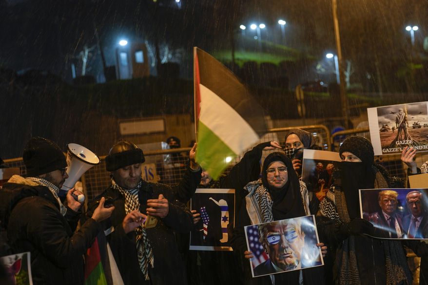 People chant slogans during a protest against U.S. President Donald Trump's plan to empty Gaza of Palestinians, outside the U.S. Consulate in Istanbul, Turkey, Thursday, Feb. 6, 2025. (AP Photo/Khalil Hamra)