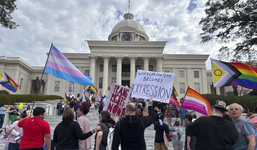 Demonstrators march to the Alabama Capitol in Montgomery, Ala., on Feb. 5, 2025 to protest bills that would impact transgender people. (AP Photo/Kim Chandler)