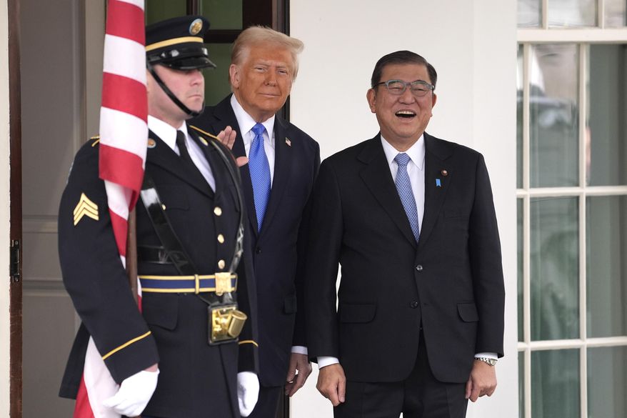 President Donald Trump, center, greets Japan's Prime Minister Shigeru Ishiba, right, at the White House, Friday, Feb. 7, 2025, in Washington. (AP Photo/Evan Vucci)