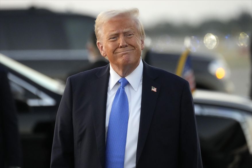 President Donald Trump smiles as he arrives on Air Force One at Palm Beach International Airport in West Palm Beach, Fla., Friday, Feb. 7, 2025. (AP Photo/Ben Curtis)