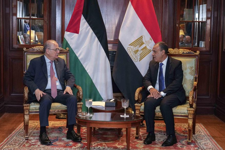 Arab League Secretary-General Ahmed Aboul Gheit, right, meets with Palestinian Prime Minister Mohammed Mustafa during his visit at the Arab League headquarters in Cairo, Egypt, Thursday, Feb. 6, 2025. (AP Photo/Amr Nabil)